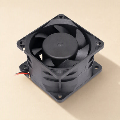 Windcraft DC Cooling Fan – top-down angled view of a black square fan showing the hub, blades and ribbed side housing