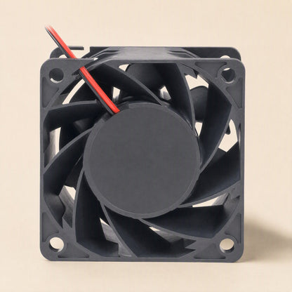 Windcraft DC Cooling Fan – rear view of a black square fan with a flat round hub, curved blades and red and black wires