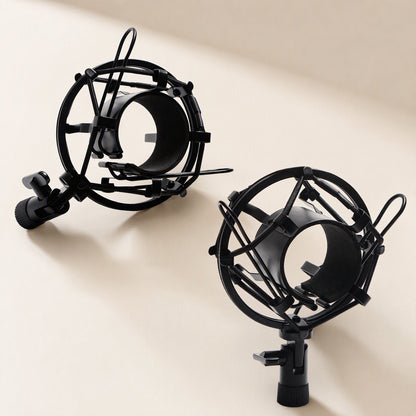 Micnest – Two black spider-style shock mounts shown from different angles on a cream background