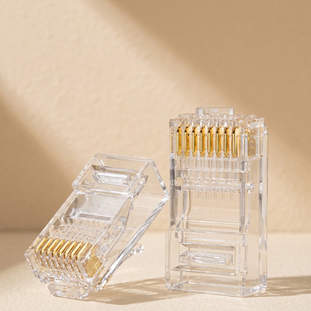 Pinjoin CAT6 RJ45 crystal head connectors, one lying down and one upright, gold contacts visible