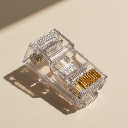 Pinjoin – Close-up top view of a transparent RJ45 connector showing its row of gold-plated contacts