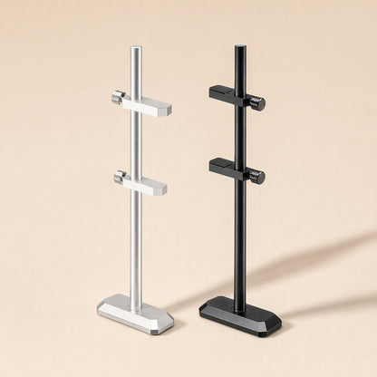 Chipbrace aluminum alloy graphics card bracket in silver and black, each with two clamp arms, on beige