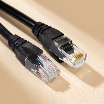 Twistcord – Two black RJ-45 connectors side by side, showing clear plugs and color-coded wires inside