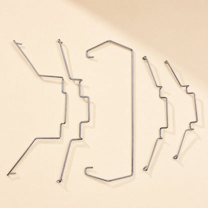 Fanclasp – Five bent steel wire fan clips in varied shapes arranged side by side, including one long U-shaped clip