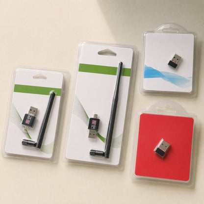Netplug USB Wireless Network Card in four retail blister packs, with and without antennas, on a cream surface