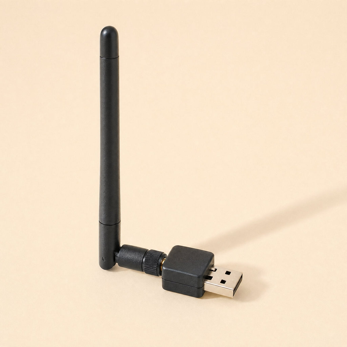 Netplug USB Wireless Network Card – black USB wireless adapter with antenna attached, shown standing upright from the side