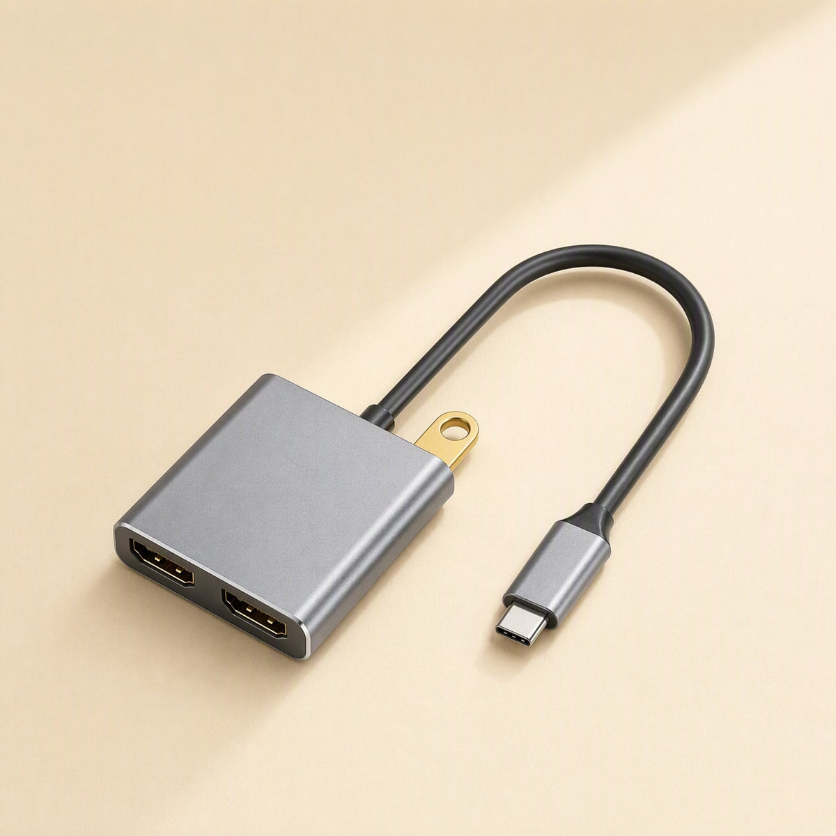 Twinview – Gray dual HDMI docking station with short cable, USB-C plug and gold USB connector on a cream background