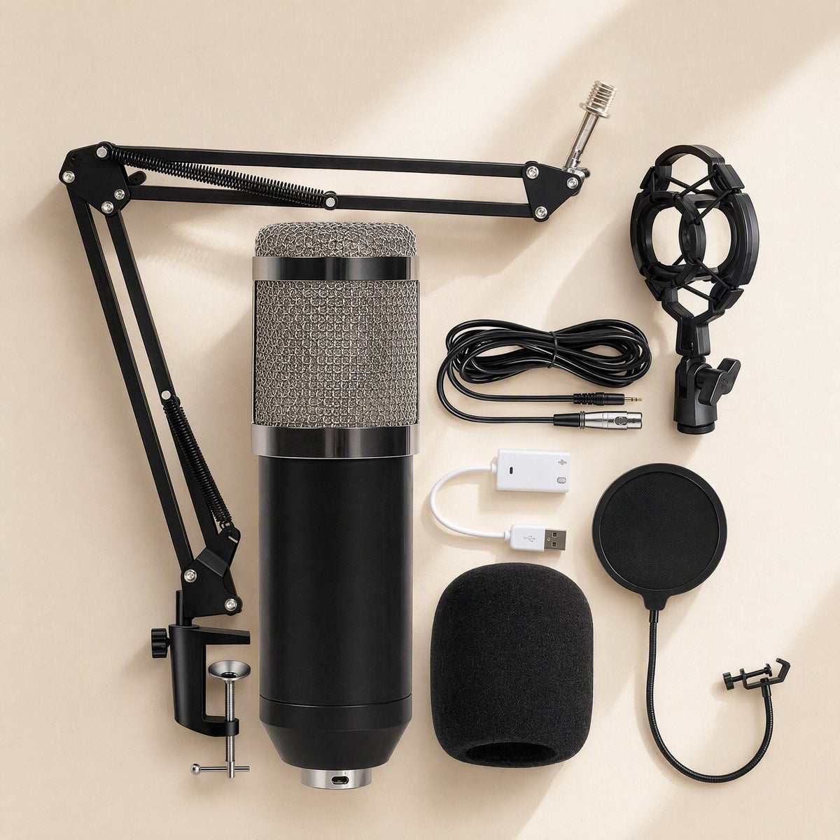 Micmellow – Black microphone with silver mesh grille, boom arm, shock mount, pop filter, foam cover and USB sound card