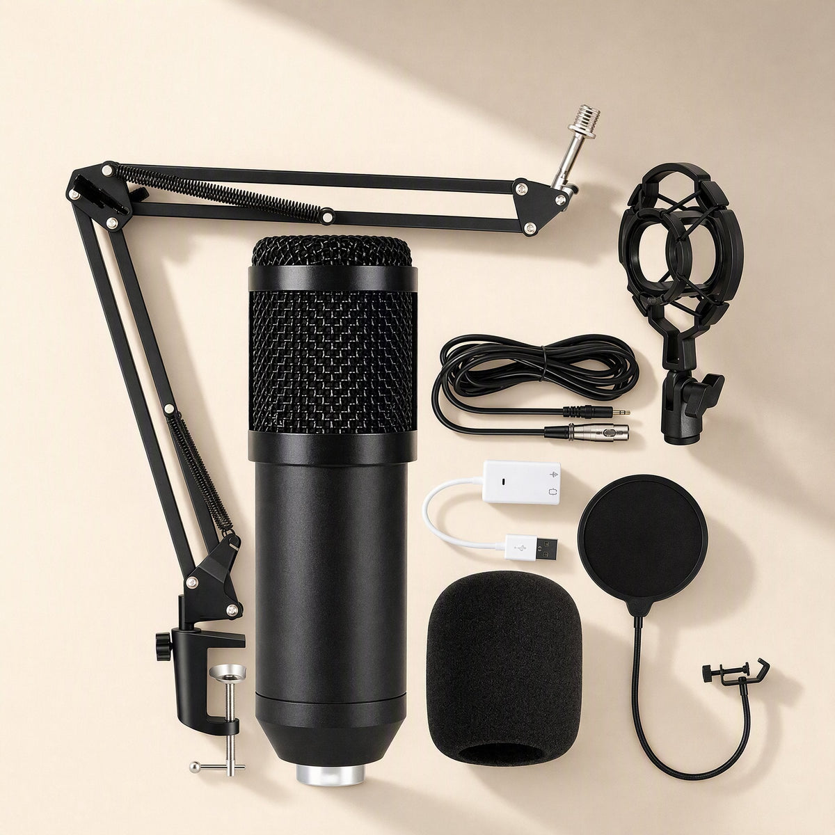 Micmellow – All-black condenser microphone kit laid flat with boom arm, pop filter, foam cover, cables and USB adapter