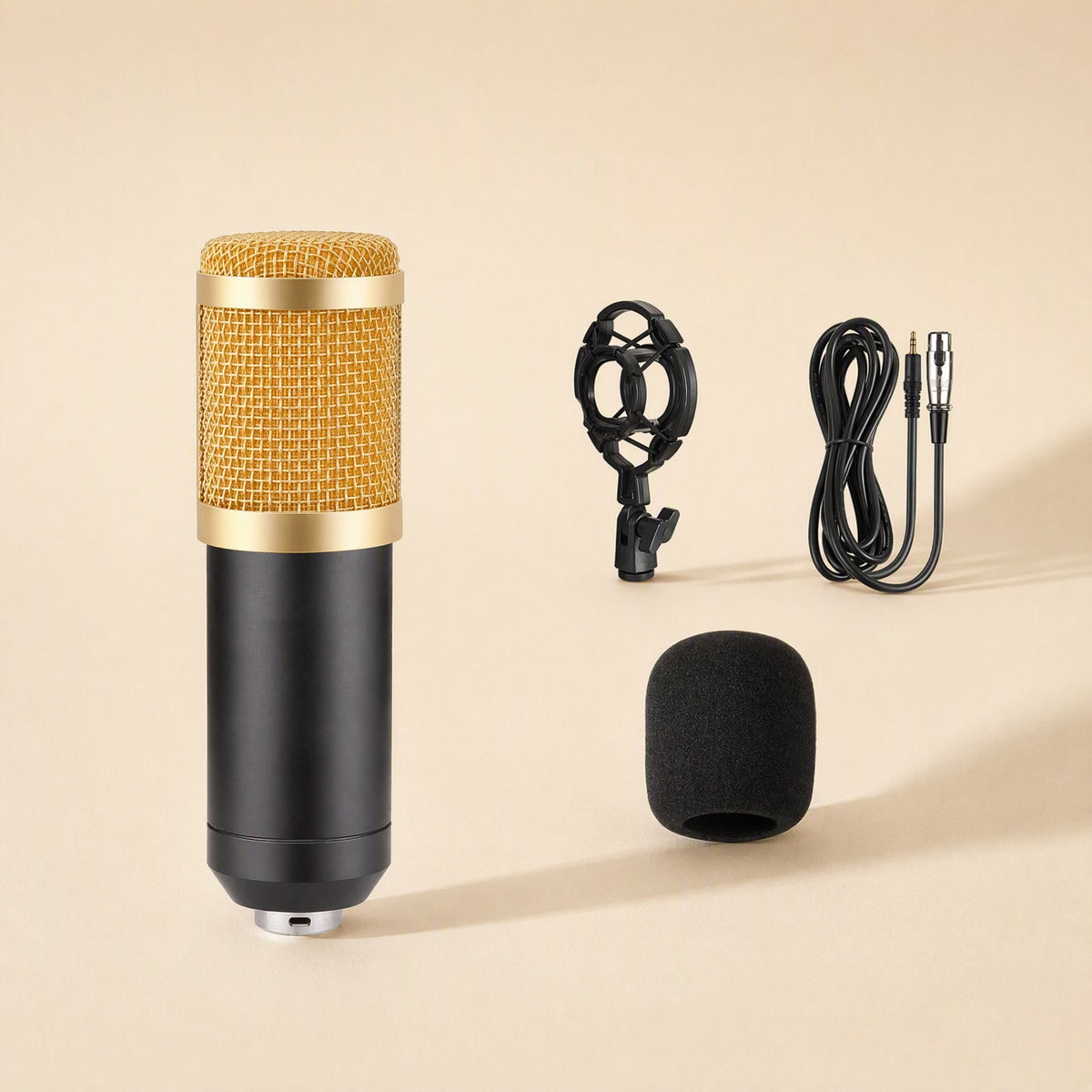 Micmellow – Gold-mesh microphone with black body, spider shock mount, foam windscreen and coiled XLR cable on beige