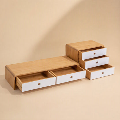Bamboorise – Bamboo monitor stand with two open white drawers beside a three-drawer bamboo and white desktop organizer