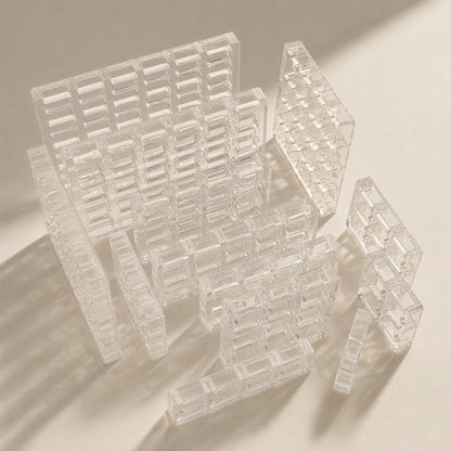 Switchframe Acrylic Switch Tester frames in several sizes, stacked and standing on a cream surface
