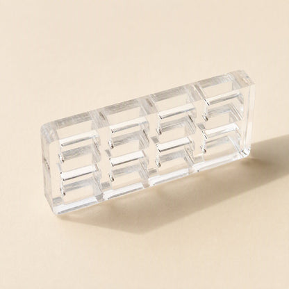 Switchframe – Small 4x2 clear acrylic switch tester frame with eight openings, angled on a beige background