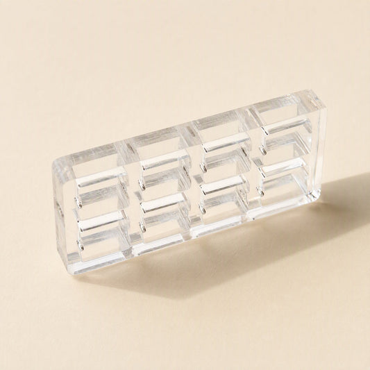 Switchframe – Small 4x2 clear acrylic switch tester frame with eight openings, angled on a beige background