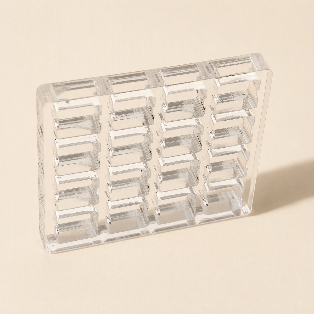 Switchframe – Four-column clear acrylic switch tester frame with six rows of slots, tilted to show its thickness