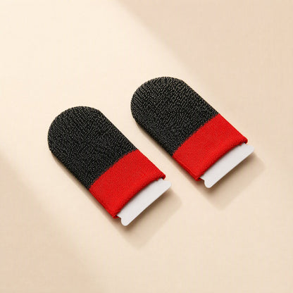 Silvertouch – Two black finger sleeves with red fabric cuffs on small white backing cards, shown at an angle