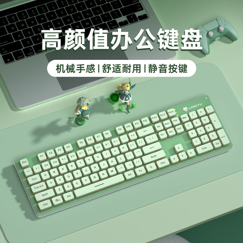 Hushkey L1 Wired Keyboard – mint green 104-key keyboard on a desk beside a laptop, gamepad and two small figurines