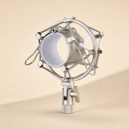 Micbuffer – Silver mic holder upright on a stand adapter, with elastic cords suspending the white-lined cradle