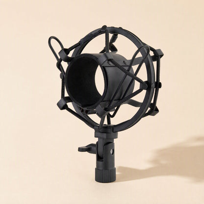 Micbuffer – Black version of the shock mount, front angle with dark foam-lined cradle and knurled screw base