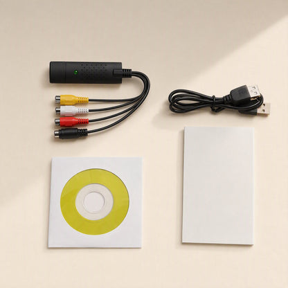 Videolink – Capture card laid out with its USB extension cable, software CD in sleeve and a blank paper card