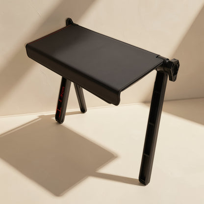 Screenstash – Black rack seen from above with a red measurement mark on one leg and a clamp at the rear