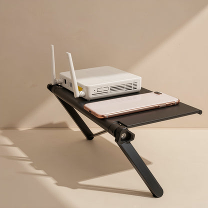 Screenstash – Rack holding a white Wi-Fi router and a rose gold smartphone, supported by angled black legs