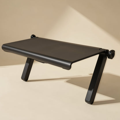 Screenstash Monitor Stand Storage Rack – low-angle view of the black shelf with a rounded front lip and two angled legs