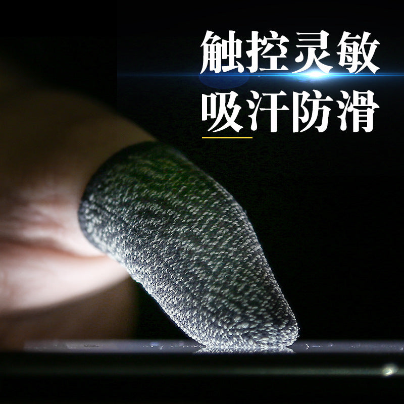 Coppertip – Close-up of a knitted copper fiber finger sleeve on a thumb pressing a touchscreen, dark background