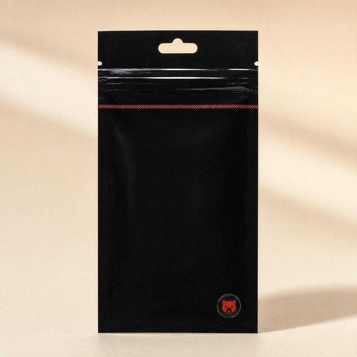 Meltlink – Closed black zip pouch with a red stripe near the top and a small red bear logo at the bottom corner