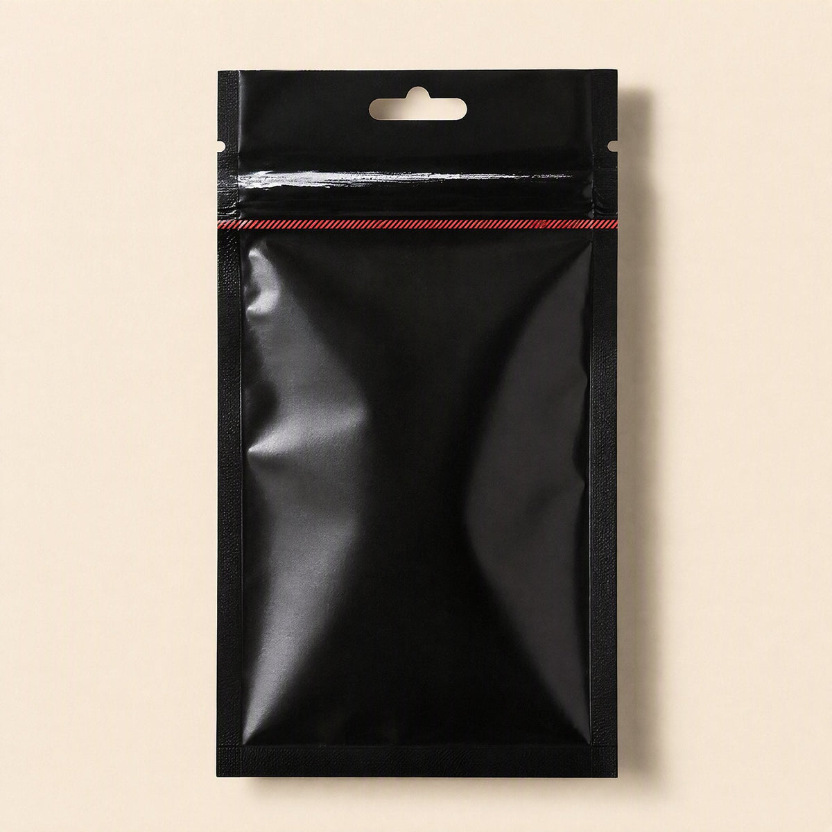 Meltlink – Front of a black resealable pouch with hang hole and red striped seal, on a plain beige background