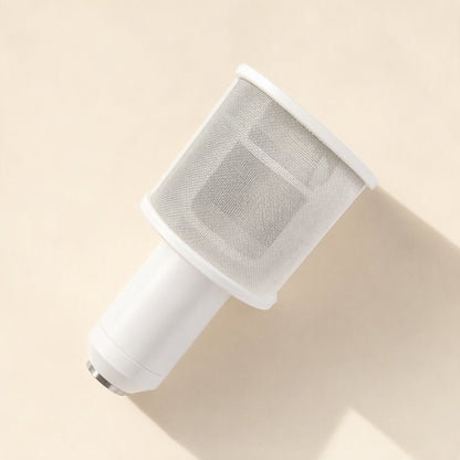 Curvecatch U-Shaped Microphone Pop Filter – white mesh pop filter wrapped around a white microphone, seen from an angle