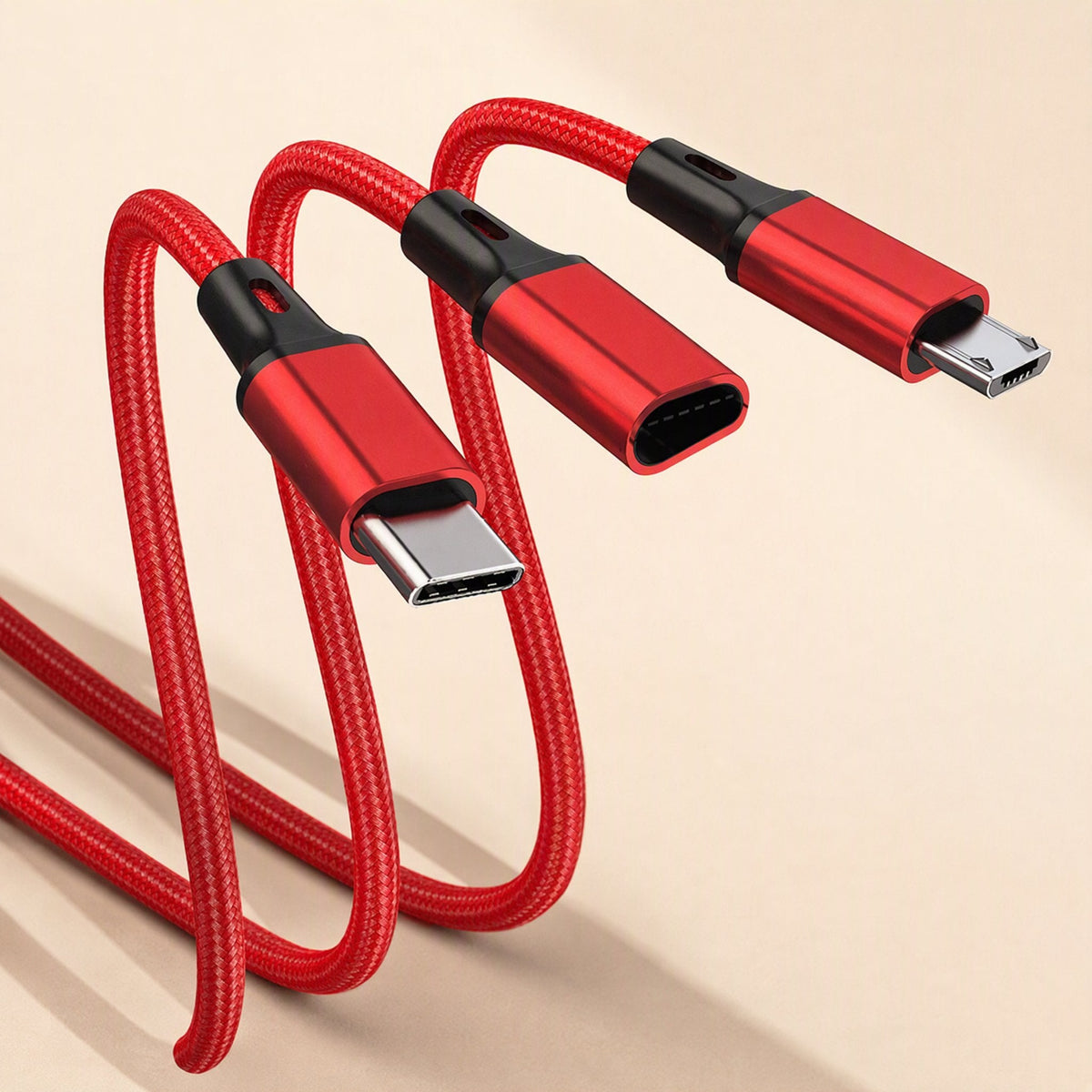Wovenlink – Close-up of red braided cable splitting into USB-C, a female port and micro-USB connectors