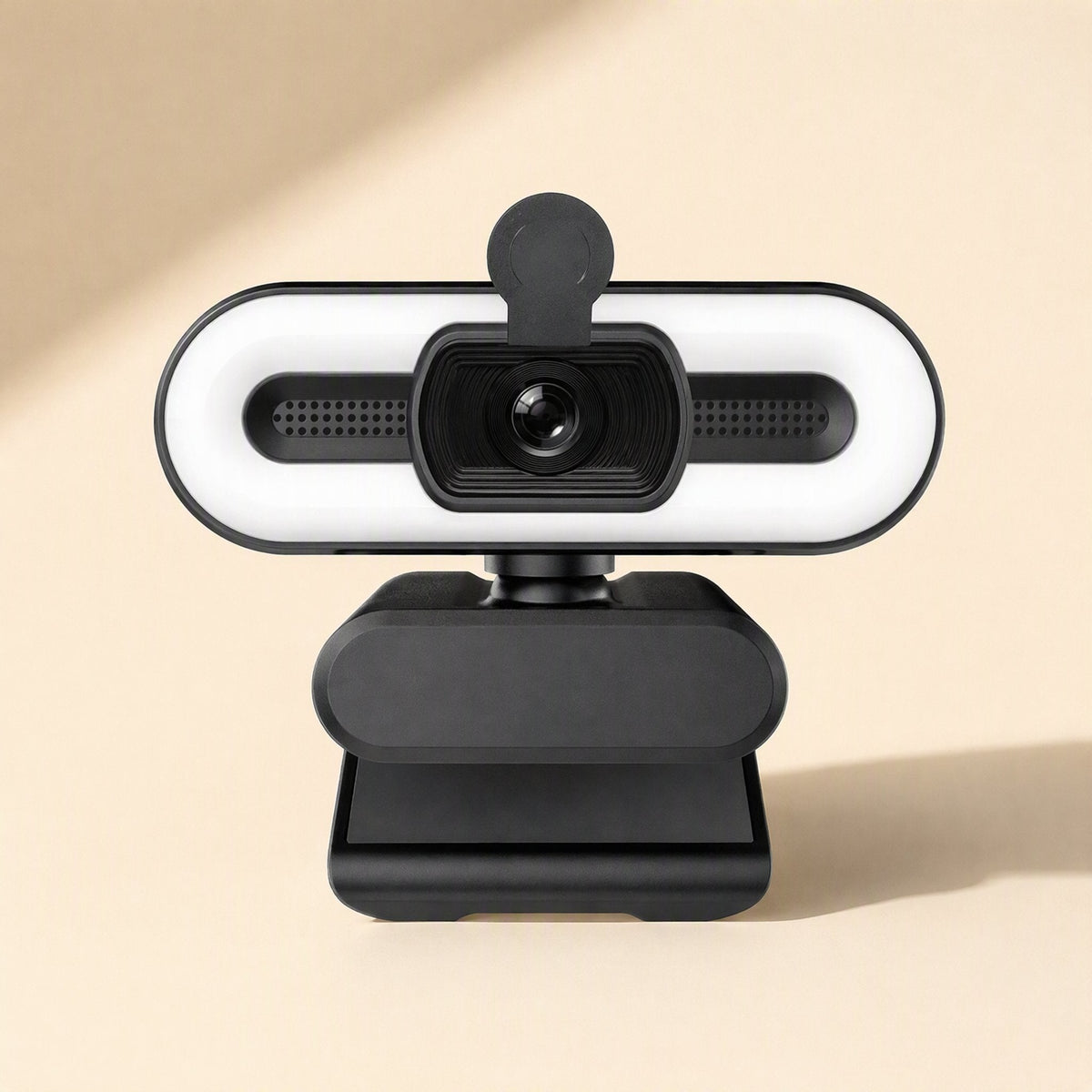 Quickfocus USB Computer Camera, front view with ring light, privacy cover and clip stand on beige backdrop
