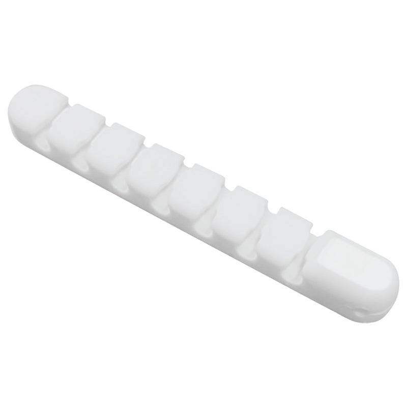 Wirenest – White multi-slot cord clip with seven grooves, shown at an angle on a plain white background