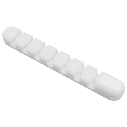 Wirenest – White multi-slot cord clip with seven grooves, shown at an angle on a plain white background