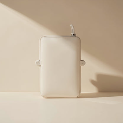 Trackroll – Cream-colored trackball mouse housing seen from behind, with mounting tabs and cable at the top