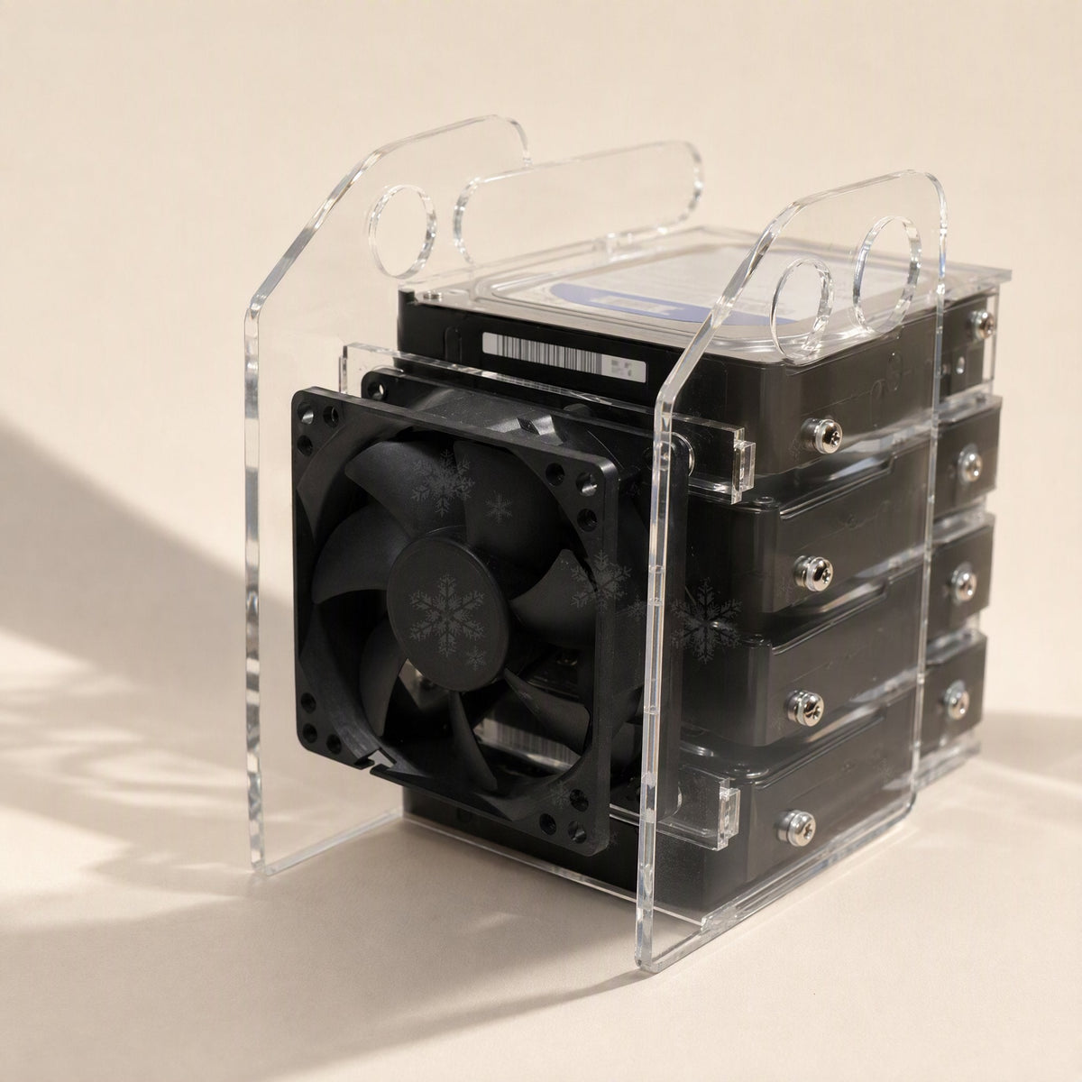 Diskview – Rack from behind with a black fan mounted at the drive ends and screws visible on the stacked disks