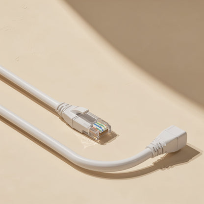 Pairpath – Long white Ethernet cable curved on a beige surface, one RJ-45 plug at the front and a right-angle end