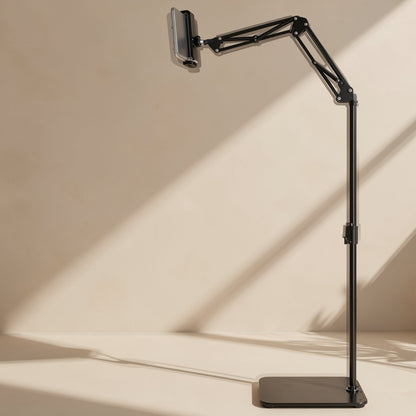 Risepost Metal Mobile Phone Floor Stand with a folding cantilever arm holding a phone, in warm sunlight