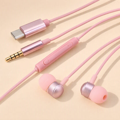 Earchime – Pink wired earbuds with inline volume remote, Type-C connector and 3.5mm plug laid on a cream background