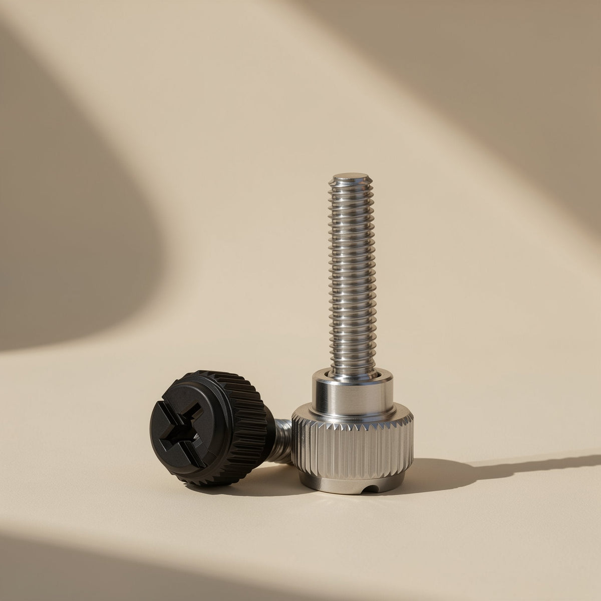 Casebolt Carbon Steel Computer Case Screw in nickel-plated and black finishes, one standing and one on its side