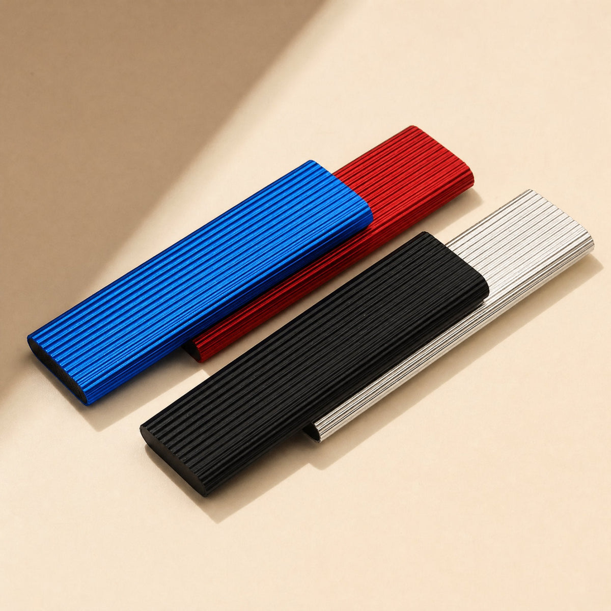 Ministore Mini Metal External Solid State Drive in blue, red, black and silver with ribbed aluminum casings