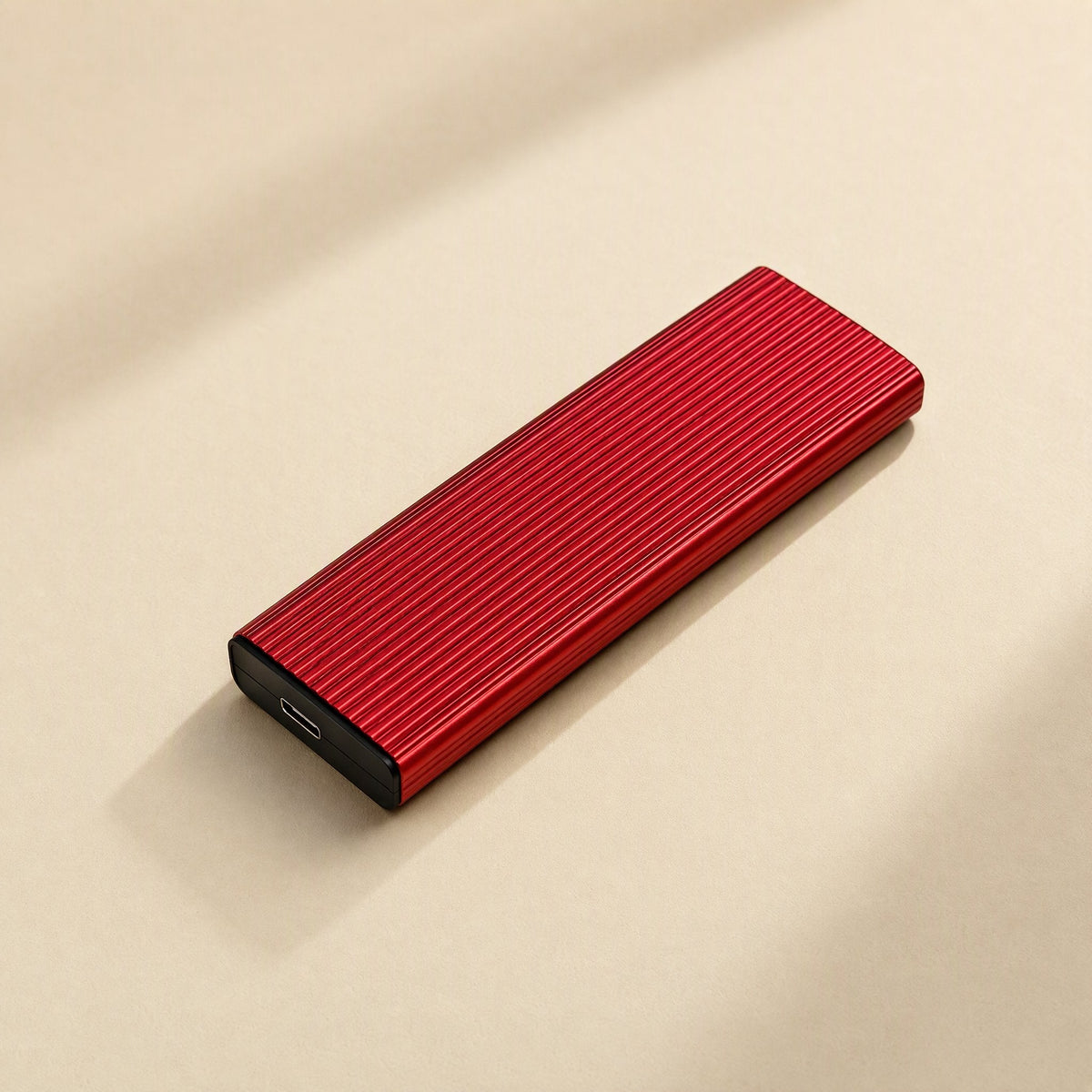 Ministore Mini Metal External Solid State Drive – red ribbed metal drive lying flat, USB-C port visible on the short end