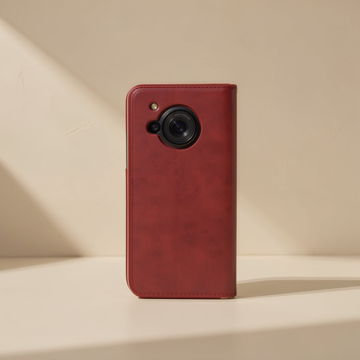 Softshell PU Leather AQUOS Phone Case in deep red, back view with large round camera cutout, standing upright