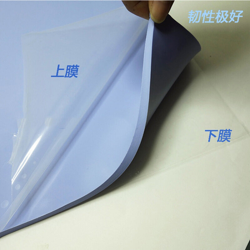 Dewflex – Close-up of a blue thermal pad sheet with the clear top film being peeled back from the bottom film