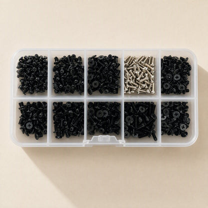 Screwstack Laptop Screw Set in a clear 10-compartment box, top view, nine black and one silver screw section