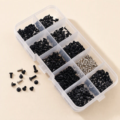 Screwstack – Angled view of the open organizer box with sorted black and silver screws and loose screws beside it
