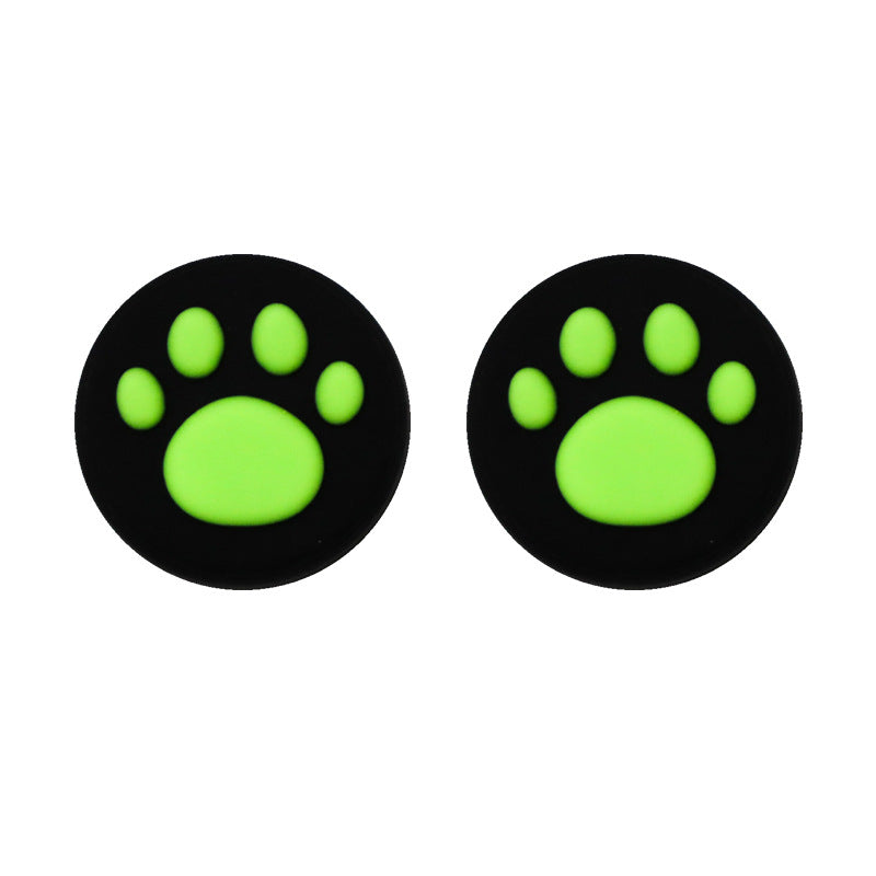 Clawbit – Pair of black thumbstick caps with bright green cat paw prints, shown side by side on white