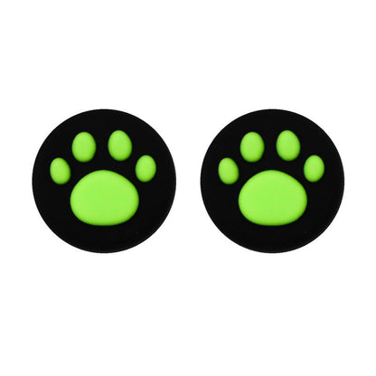 Clawbit – Pair of black thumbstick caps with bright green cat paw prints, shown side by side on white