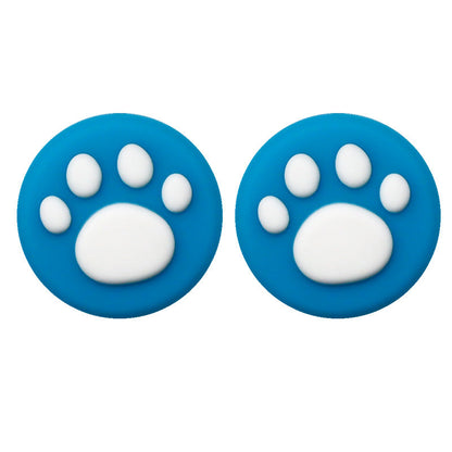 Clawbit – Pair of blue silicone joystick caps with white cat paw prints, shown side by side on a white background